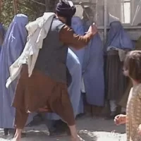 Taliban beating women